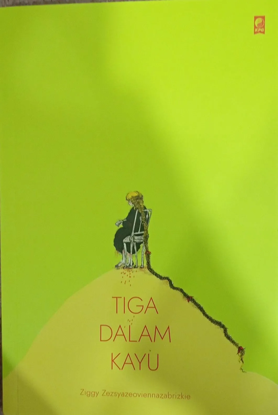 Cover TIGA DALAM KAYU